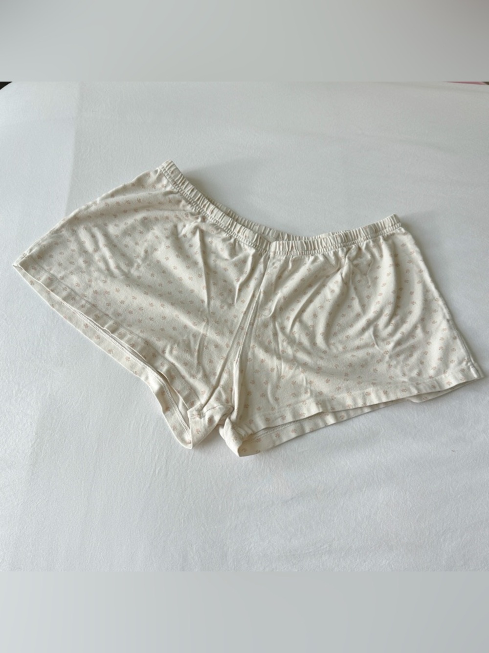 Brandy Melville cream shorts with pink flowers